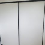 Woodsman wardrobe doors black framed white melamine