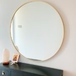 Round brushed brass mirror insitu